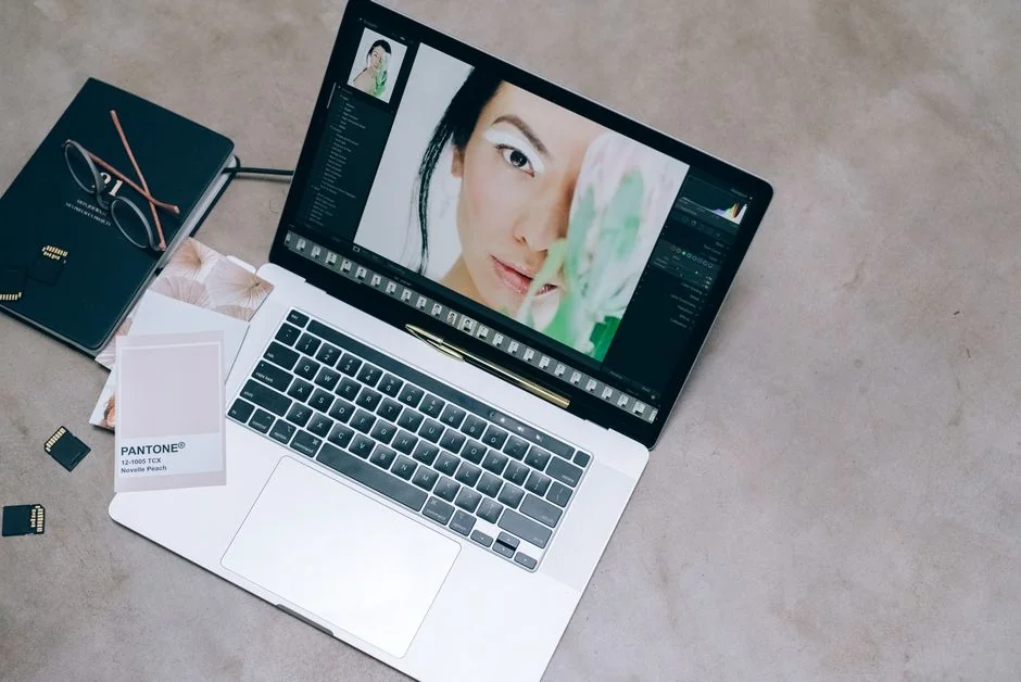 A modern workspace featuring dual computer monitors displaying web design projects, emphasizing technology and productivity.